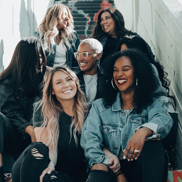 7 women sitting on stairs